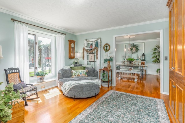 4561 Bent Creek Pl, Grove City, OH 43123 - sitting room featuring wood finished floors, a textured ceiling, crown molding, and a chandelier
