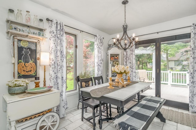 4561 Bent Creek Pl, Grove City, OH 43123 - dining space featuring light tile patterned flooring and a chandelier