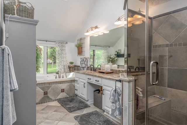 4561 Bent Creek Pl, Grove City, OH 43123 - full bath with vanity, a bath, a stall shower, vaulted ceiling, and healthy amount of natural light