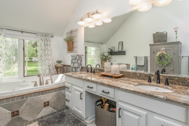 4561 Bent Creek Pl, Grove City, OH 43123 - full bath with double vanity, vaulted ceiling, and a bath