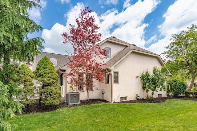 4561 Bent Creek Pl, Grove City, OH 43123 - back of property featuring stucco siding, a yard, cooling unit, and a shingled roof