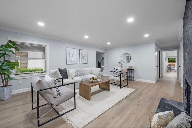 2583 Wexford Rd, Columbus, OH 43221 - living room featuring ornamental molding, recessed lighting, baseboards, and light wood-type flooring