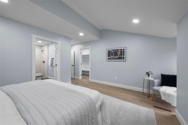 2583 Wexford Rd, Columbus, OH 43221 - bedroom with light wood-style floors, recessed lighting, baseboards, connected bathroom, and a spacious closet