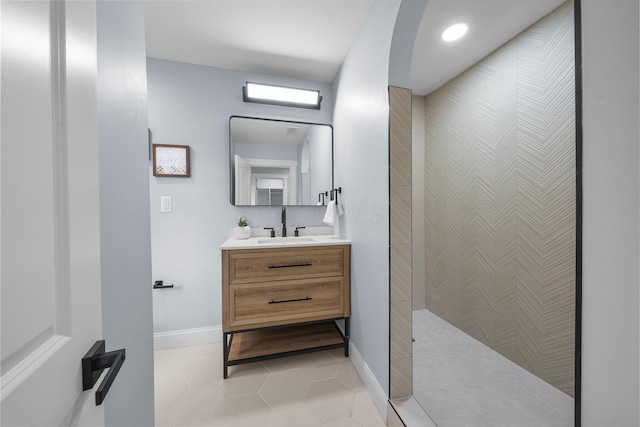 2583 Wexford Rd, Columbus, OH 43221 - bathroom featuring vanity, baseboards, tile patterned floors, walk in shower, and recessed lighting