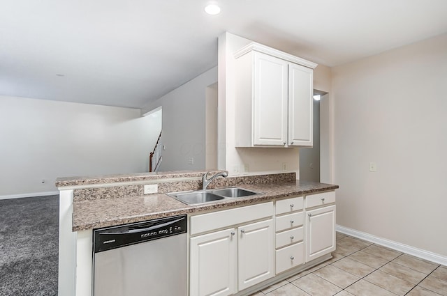 2697 Rinaldi Dr, Columbus, OH 43219 - kitchen with dishwasher, a sink, white cabinetry, baseboards, and recessed lighting