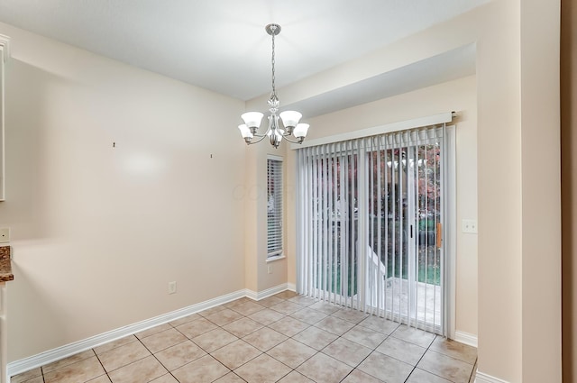 2697 Rinaldi Dr, Columbus, OH 43219 - spare room featuring light tile patterned floors, plenty of natural light, a chandelier, and baseboards