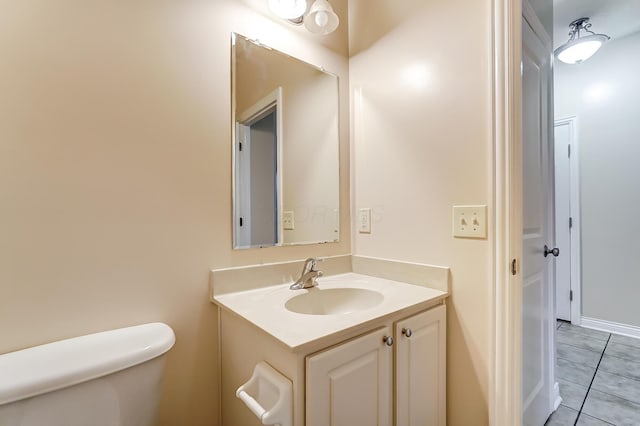 2697 Rinaldi Dr, Columbus, OH 43219 - half bathroom with toilet, vanity, and tile patterned floors