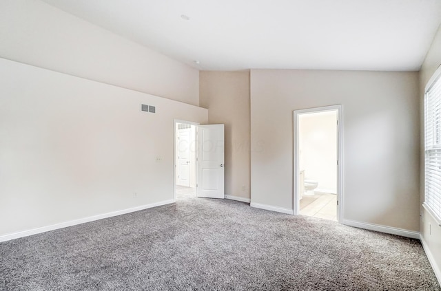 2697 Rinaldi Dr, Columbus, OH 43219 - unfurnished bedroom with carpet flooring, baseboards, high vaulted ceiling, and ensuite bathroom