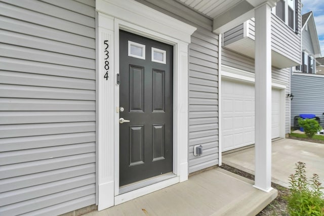 5384 Coble Meadows Ln, Canal Winchester, OH 43110 - doorway to property featuring covered porch and a garage