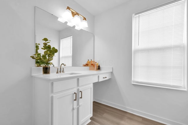 5384 Coble Meadows Ln, Canal Winchester, OH 43110 - bathroom featuring wood finished floors, vanity, and baseboards