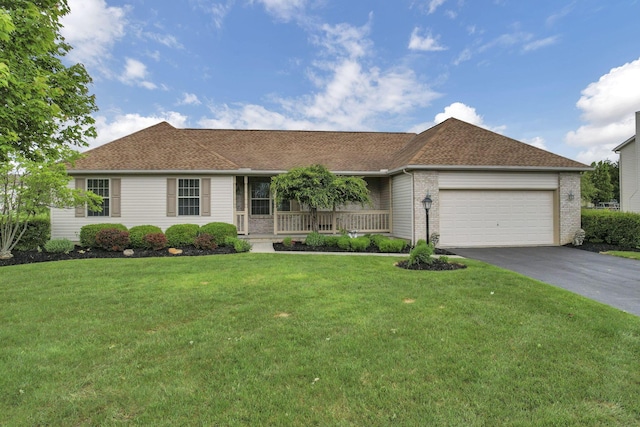 83 Penrod Ave, Pataskala, OH 43062 - ranch-style house with covered porch, asphalt driveway, a garage, a front yard, and roof with shingles