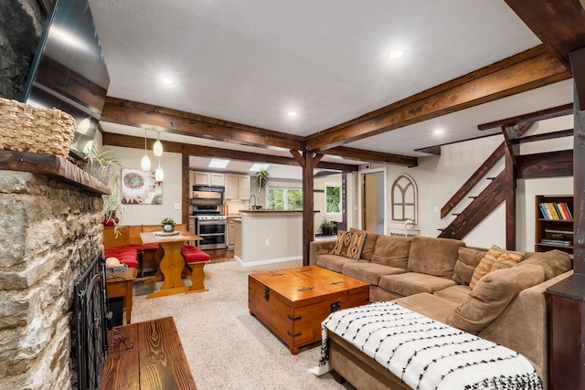 796 Mulberry Dr, Columbus, OH 43235 - living area featuring light carpet, recessed lighting, a fireplace, stairs, and beamed ceiling