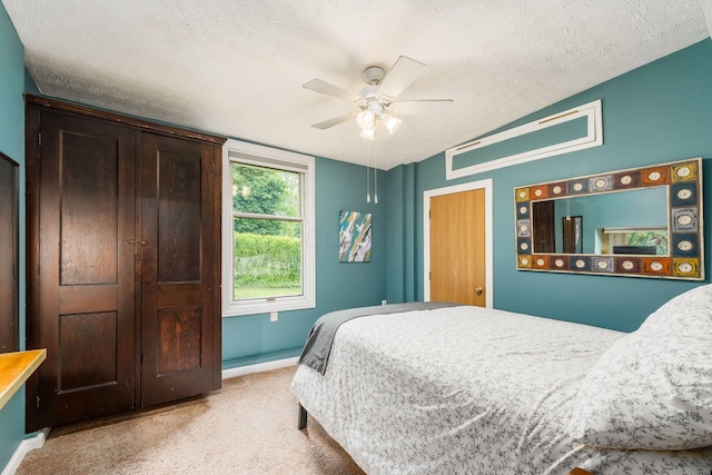 796 Mulberry Dr, Columbus, OH 43235 - bedroom with carpet floors, a textured ceiling, ceiling fan, and baseboards