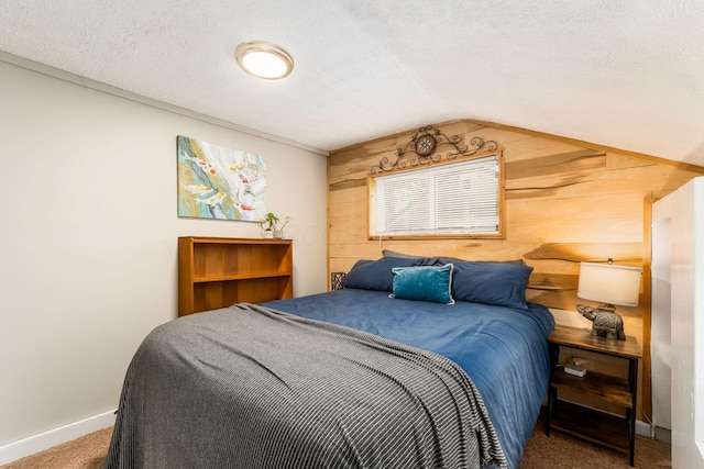 796 Mulberry Dr, Columbus, OH 43235 - bedroom with wooden walls, carpet, lofted ceiling, baseboards, and a textured ceiling