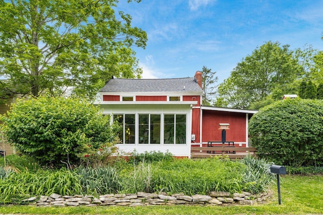 796 Mulberry Dr, Columbus, OH 43235 - back of property featuring a chimney and a sunroom