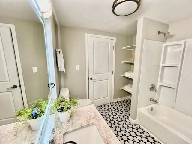79 N Main St, Jeffersonville, OH 43128 - bathroom with tile patterned floors, vanity, and washtub / shower combination