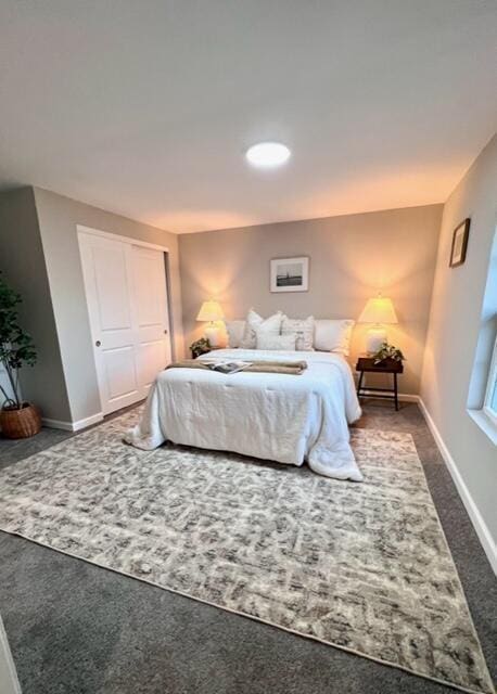 79 N Main St, Jeffersonville, OH 43128 - bedroom featuring baseboards, carpet, and a closet