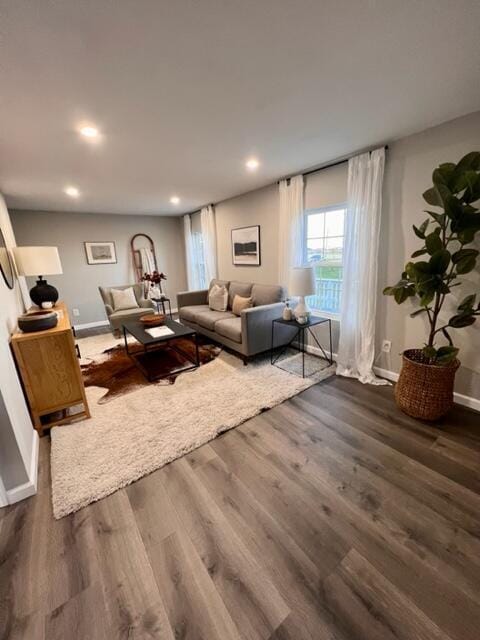 79 N Main St, Jeffersonville, OH 43128 - living room featuring baseboards, recessed lighting, and dark wood-style floors