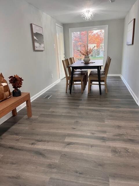 79 N Main St, Jeffersonville, OH 43128 - dining room featuring baseboards and dark wood-style flooring
