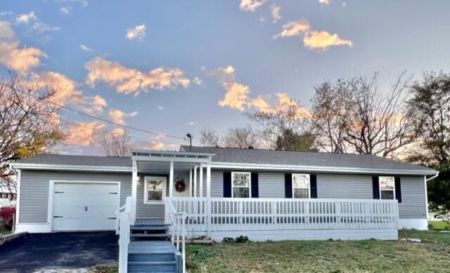 79 N Main St, Jeffersonville, OH 43128 - single story home featuring covered porch, a garage, and driveway