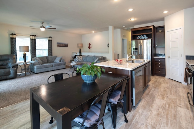 7326 State Route 19 Unit 9, Lot 297, Mount Gilead, OH 43338 - kitchen featuring dark brown cabinets, a sink, open floor plan, a ceiling fan, and recessed lighting