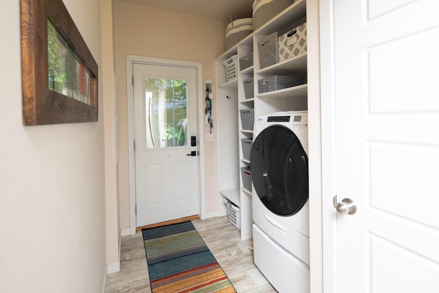 7326 State Route 19 Unit 9, Lot 297, Mount Gilead, OH 43338 - washroom featuring washer / dryer, baseboards, and light wood-style flooring