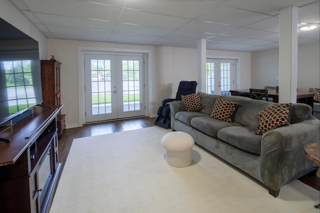 7326 State Route 19 Unit 9, Lot 297, Mount Gilead, OH 43338 - living room featuring french doors, a drop ceiling, wood finished floors, and baseboards