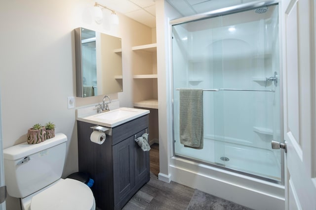 7326 State Route 19 Unit 9, Lot 297, Mount Gilead, OH 43338 - full bathroom featuring wood finished floors, toilet, vanity, a stall shower, and a paneled ceiling