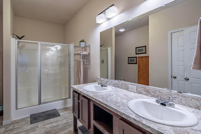 7326 State Route 19 Unit 9, Lot 297, Mount Gilead, OH 43338 - bathroom featuring a stall shower, double vanity, and wood finished floors