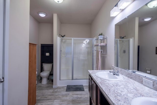 7326 State Route 19 Unit 9, Lot 297, Mount Gilead, OH 43338 - bathroom featuring toilet, a stall shower, and wood finished floors