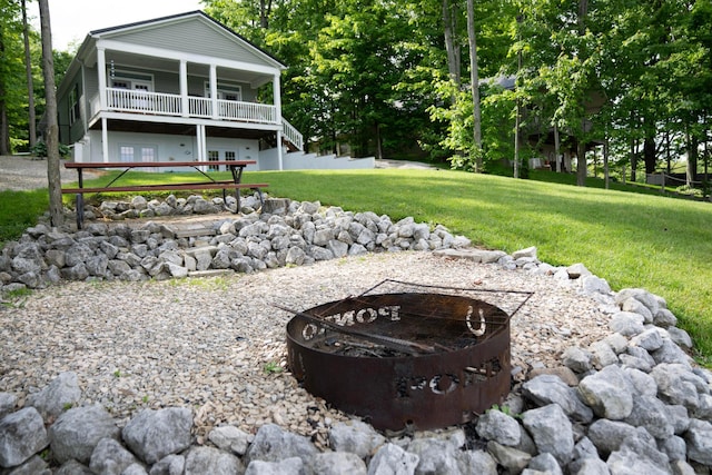 7326 State Route 19 Unit 9, Lot 297, Mount Gilead, OH 43338 - view of green lawn featuring a fire pit and stairs