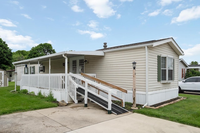 8 Winter Pine Dr, Delaware, OH 43015 - view of front of home featuring a front lawn, french doors, and covered porch