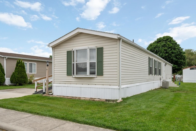 8 Winter Pine Dr, Delaware, OH 43015 - view of property exterior featuring a lawn and a cooling unit