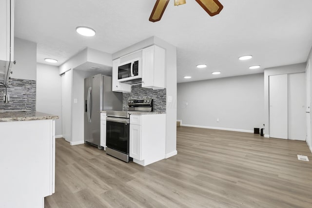 2505 Burgandy Ln Unit C, Columbus, OH 43232 - kitchen featuring stainless steel appliances, decorative backsplash, ceiling fan, light wood-type flooring, and recessed lighting