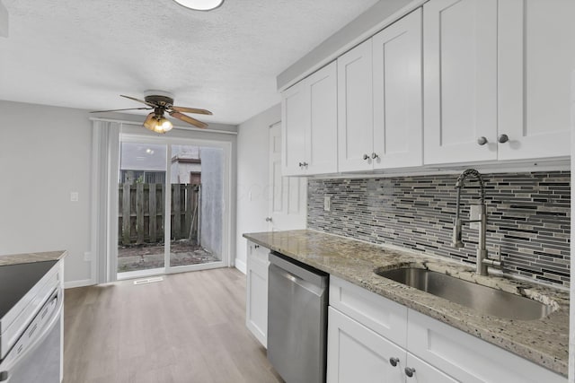 2505 Burgandy Ln Unit C, Columbus, OH 43232 - kitchen with stainless steel dishwasher, a sink, dishwashing machine, backsplash, and light wood-style floors