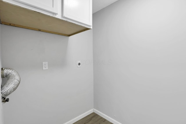 2505 Burgandy Ln Unit C, Columbus, OH 43232 - laundry room featuring cabinet space, hookup for an electric dryer, baseboards, and dark wood-style floors