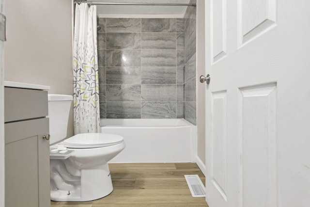 2505 Burgandy Ln Unit C, Columbus, OH 43232 - full bath with wood finished floors, toilet, shower / bath combo with shower curtain, and vanity