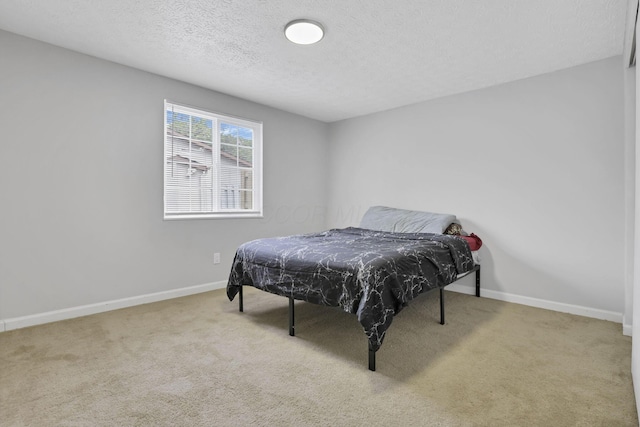 2505 Burgandy Ln Unit C, Columbus, OH 43232 - bedroom featuring carpet flooring, a textured ceiling, and baseboards