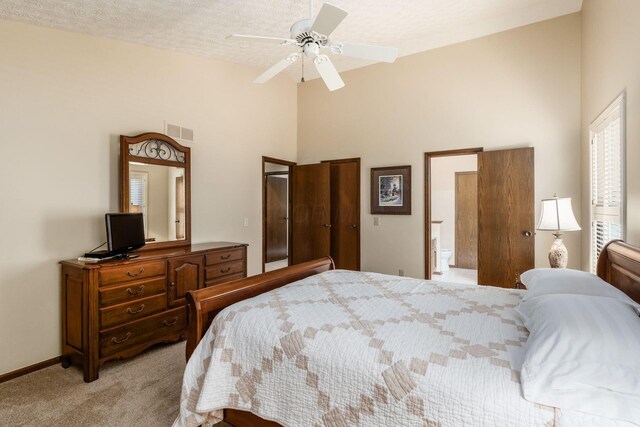 5584 Tangarey Ct, Columbus, OH 43235 - bedroom with light carpet, high vaulted ceiling, baseboards, and a ceiling fan