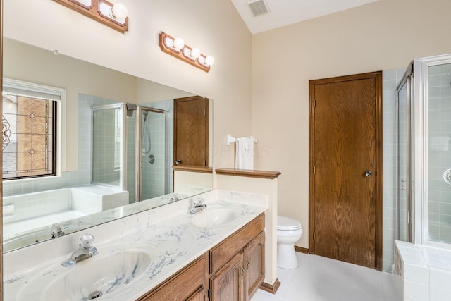 5584 Tangarey Ct, Columbus, OH 43235 - full bath with double vanity, toilet, a shower stall, and tile patterned flooring