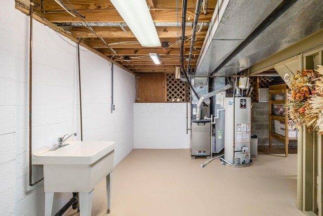 5584 Tangarey Ct, Columbus, OH 43235 - unfinished basement with gas water heater and a sink