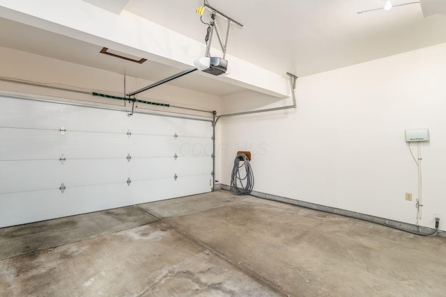 5584 Tangarey Ct, Columbus, OH 43235 - garage featuring a garage door opener