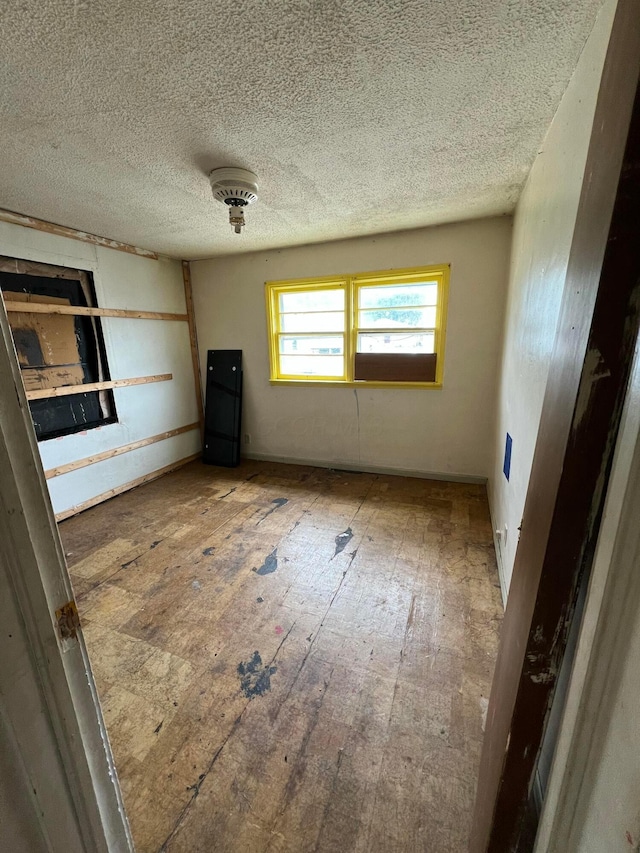 527 N 15th St, Coshocton, OH 43812 - unfurnished bedroom featuring a textured ceiling