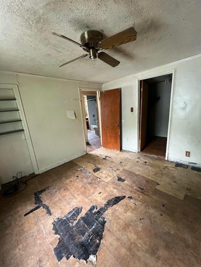 527 N 15th St, Coshocton, OH 43812 - unfurnished bedroom with a textured ceiling and a ceiling fan