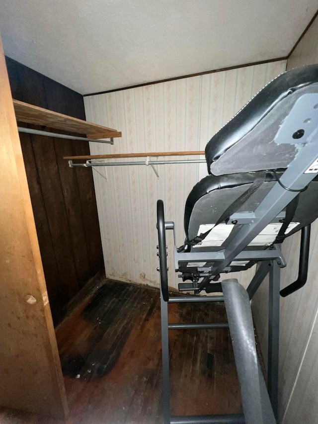 527 N 15th St, Coshocton, OH 43812 - exercise room with dark wood-style flooring and wooden walls