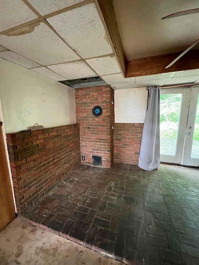 527 N 15th St, Coshocton, OH 43812 - unfurnished living room with brick wall