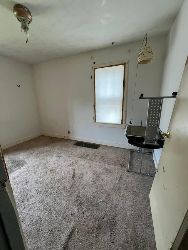 527 N 15th St, Coshocton, OH 43812 - unfurnished living room with carpet floors and baseboards
