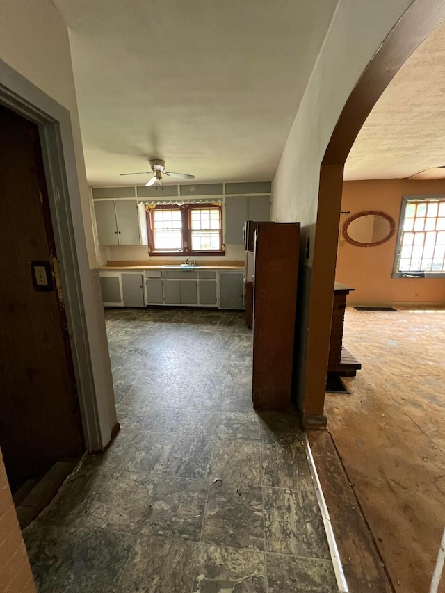 527 N 15th St, Coshocton, OH 43812 - corridor with arched walkways, plenty of natural light, and a sink