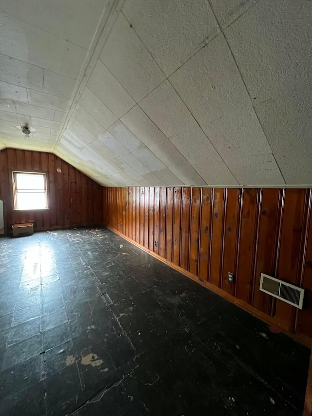 527 N 15th St, Coshocton, OH 43812 - additional living space featuring lofted ceiling, tile patterned floors, and wooden walls