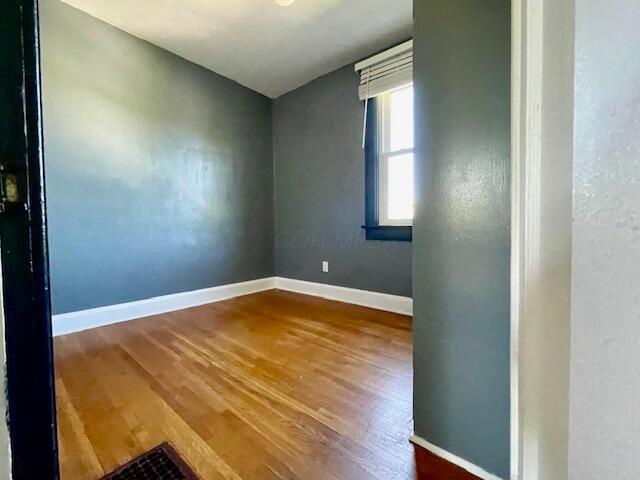 221 S Sylvan Ave, Columbus, OH 43204 - unfurnished room featuring wood finished floors and baseboards
